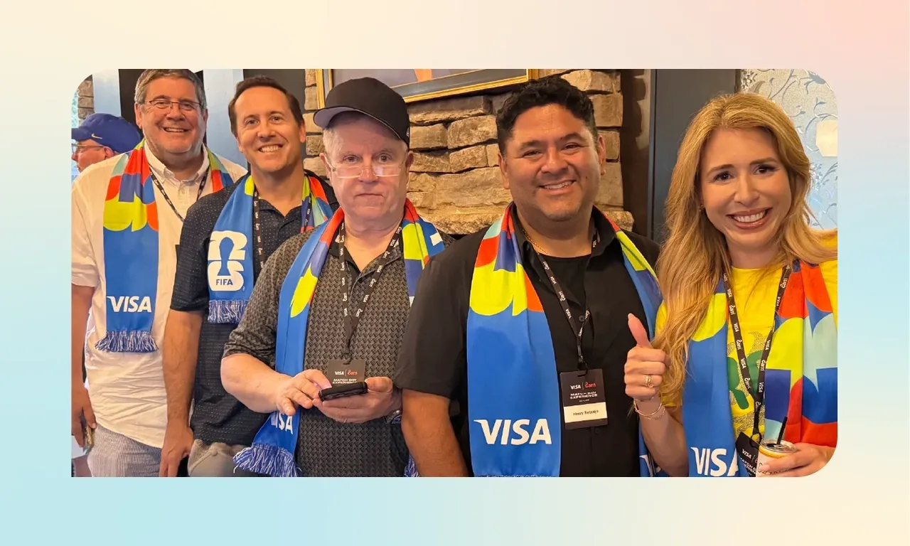 Customer-event attendees wearing Visa scarves at the July 2026 World Cup hospitality event