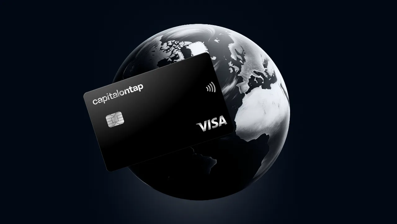 Capital on Tap business card shown in front of a globe