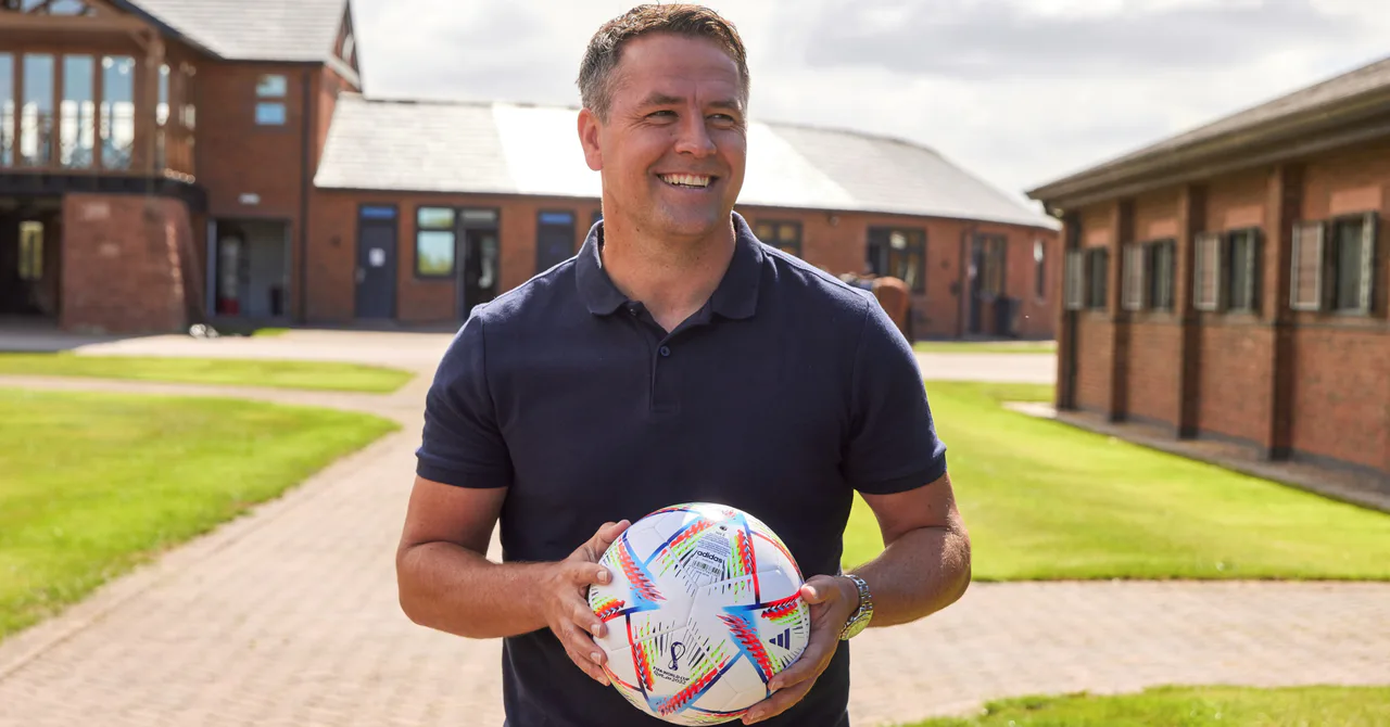 Michael Owen holding a football at Manor House Stables