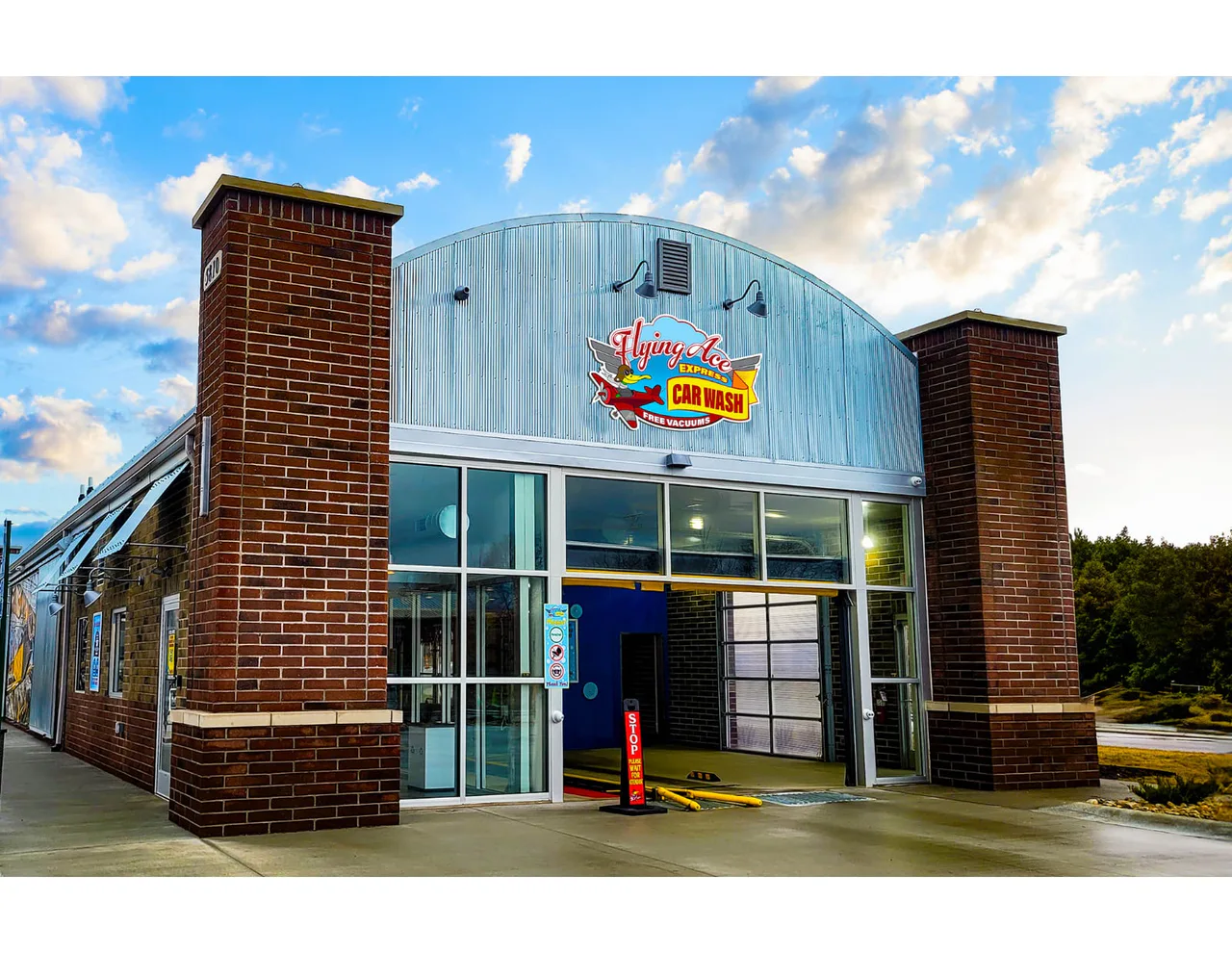 Flying Ace Express Car Wash building in the official Dayton chamber opening listing