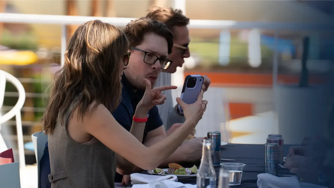 Giftbit colleagues working together at an outdoor table during a team event