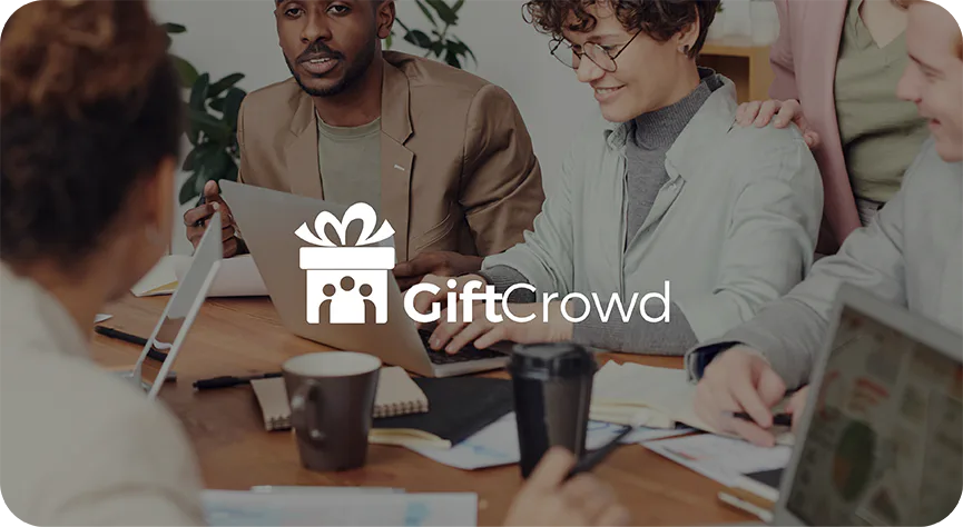 GiftCrowd logo over a photograph of people sitting together at a table