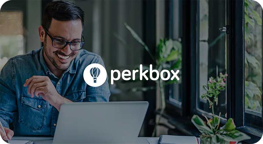 A man using a laptop behind Perkbox branding in official Runa customer case-study artwork.