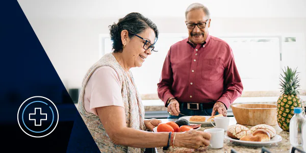 An older couple prepares food together in a kitchen, alongside a healthcare symbol on an InComm graphic.