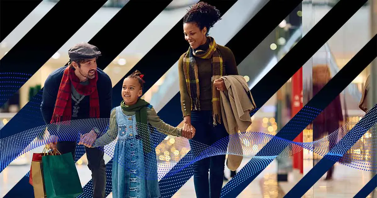 Two adults and a child shopping together, with shopping bags and a blue graphic overlay.